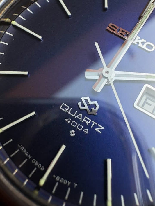 Vintage Seiko SQ 4004 watch with a blue dial and a brown leather strap