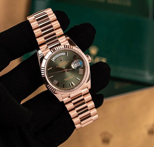 Rolex Oyster Perpetual Everose gold with an olive green dial.