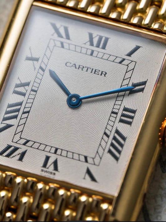 Cartier Tank Louis watch with an 18K yellow gold "Milanese" bracelet, available