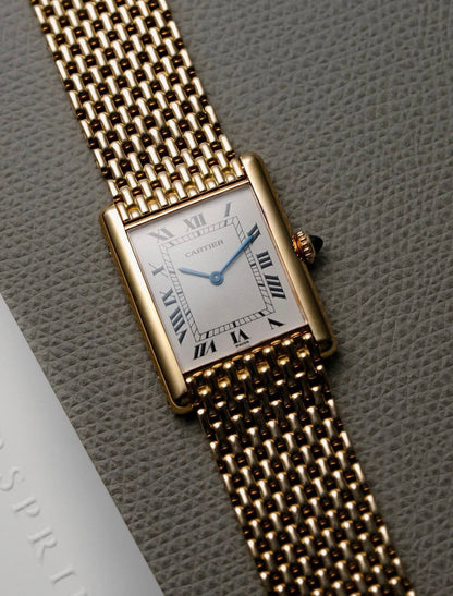 Cartier Tank Louis watch with an 18K yellow gold "Milanese" bracelet, available