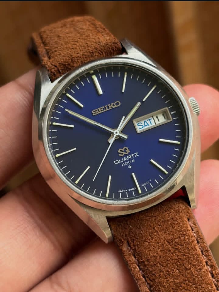Vintage Seiko SQ 4004 watch with a blue dial and a brown leather strap