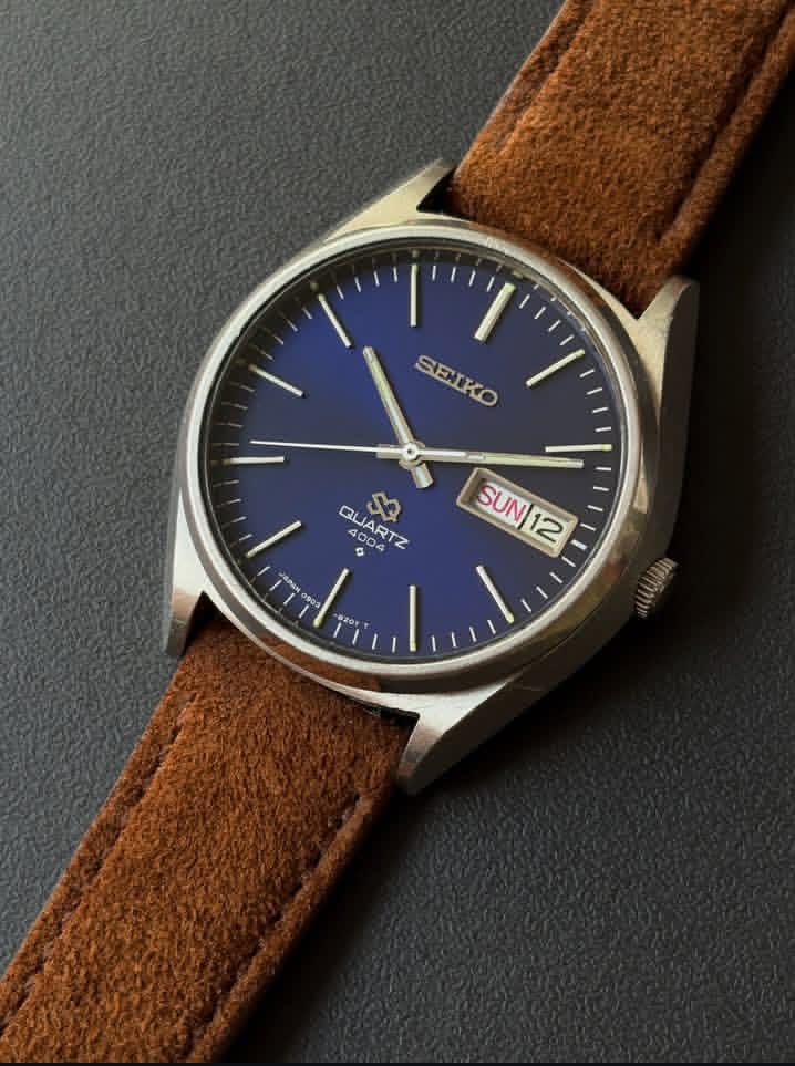 Vintage Seiko SQ 4004 watch with a blue dial and a brown leather strap