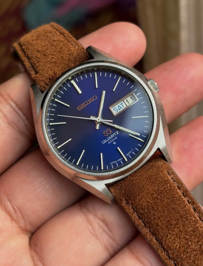Vintage Seiko SQ 4004 watch with a blue dial and a brown leather strap