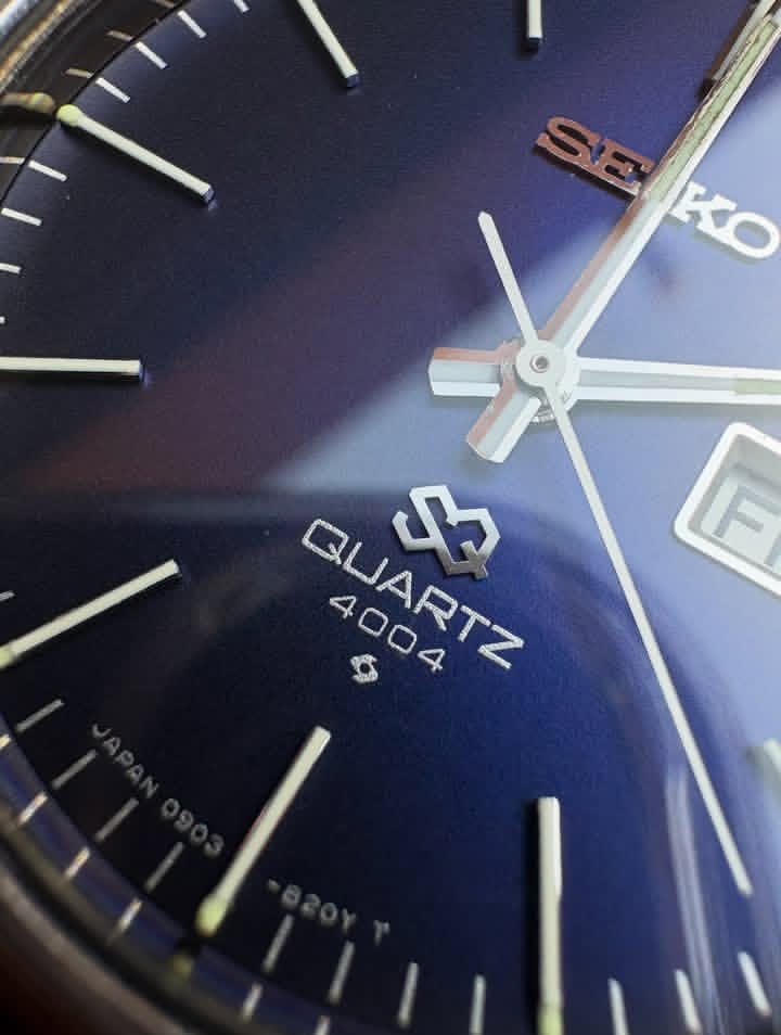 Vintage Seiko SQ 4004 watch with a blue dial and a brown leather strap